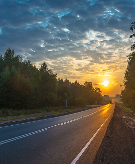 Sunset over road